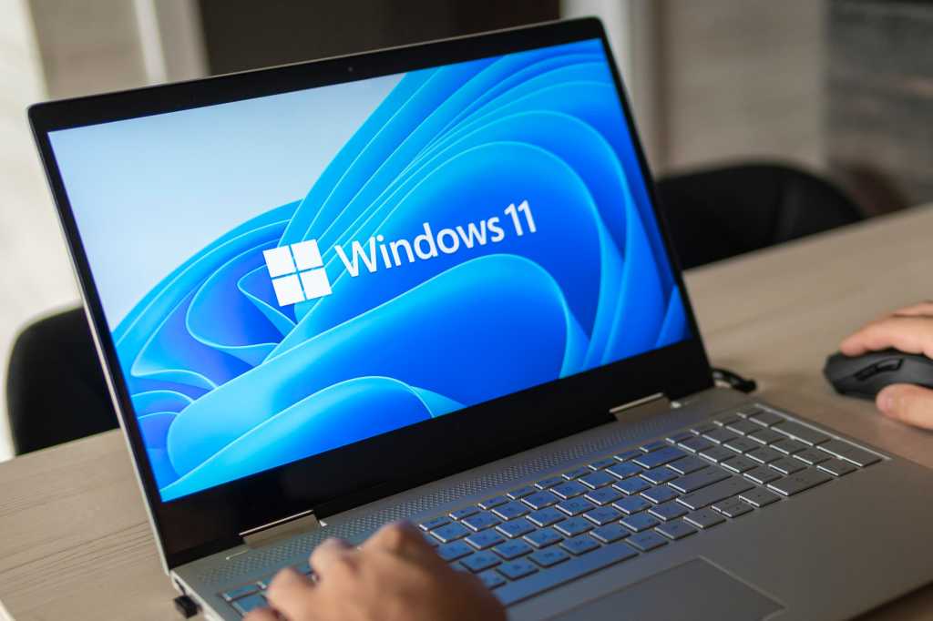 6 crucial signs it’s time to reset your Windows PC and start fresh Man working on a Windows 11 laptop clearly on screen