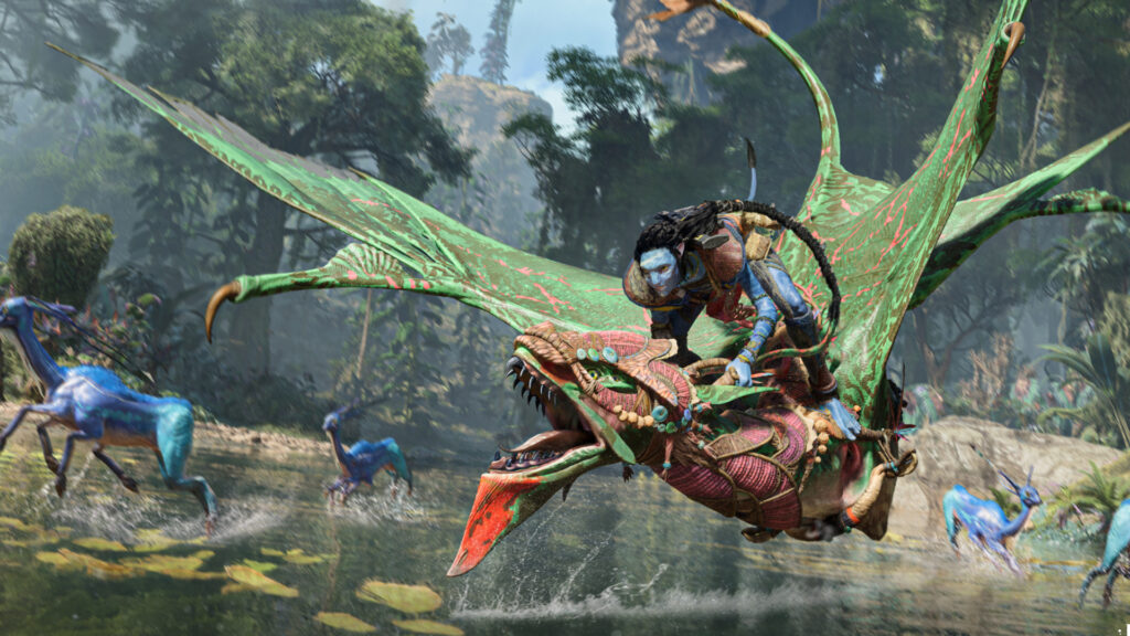 A na'vi flies their ikran low enough to skim the surface of a shallow creek in Avatar: Frontiers of Pandora.