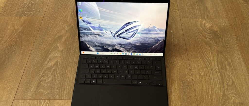 Asus ROG Flow Z13 gaming tablet on wooden surface