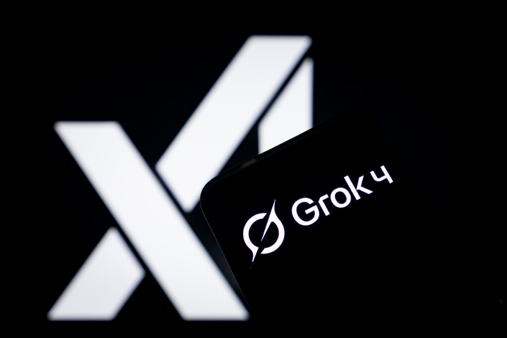 CHONGQING, CHINA - JULY 10: In this photo illustration, the logo of Grok 4 is displayed on smartphone screen with xAI logo in the background on July 10, 2025 in Chongqing, China. Elon Musk on July 10 unveiled Grok 4, a new version of his X platform's AI chatbot.