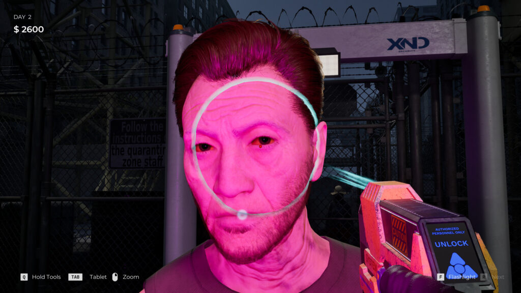 A person being scanned with UV light