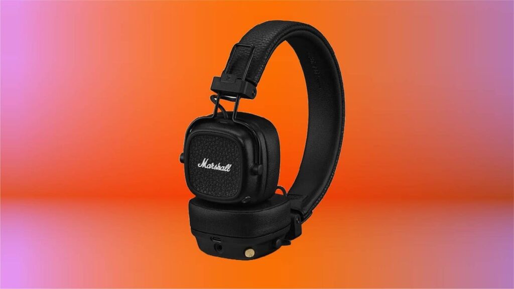 These Stylish Bluetooth Headphones With Unbelievable Battery Life Are Cheaper Than Ever Marshall Major V headphones on a magenta and orange background