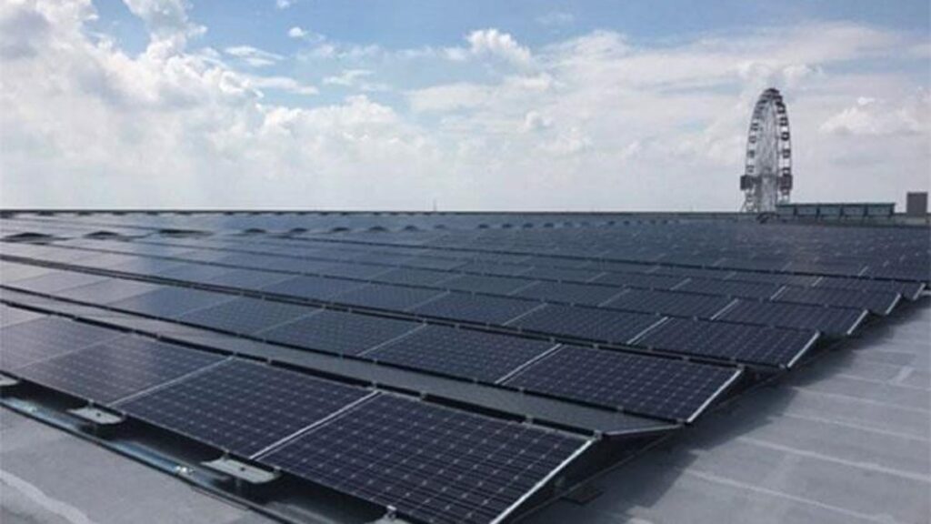 panasonic solar panel array with ferris wheel in the background