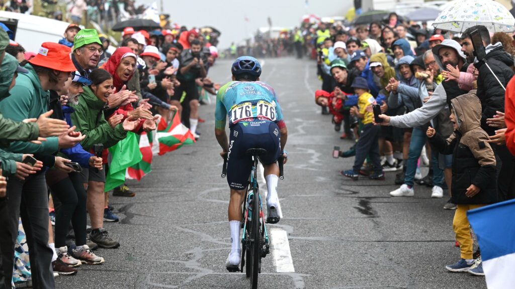 Sergio Higuita of Colombia and Team XDS Astana competes while fans cheers during the 112th Tour de France 2025, Stage 14 a 182.6km stage from Pau to Luchon-Superbagneres