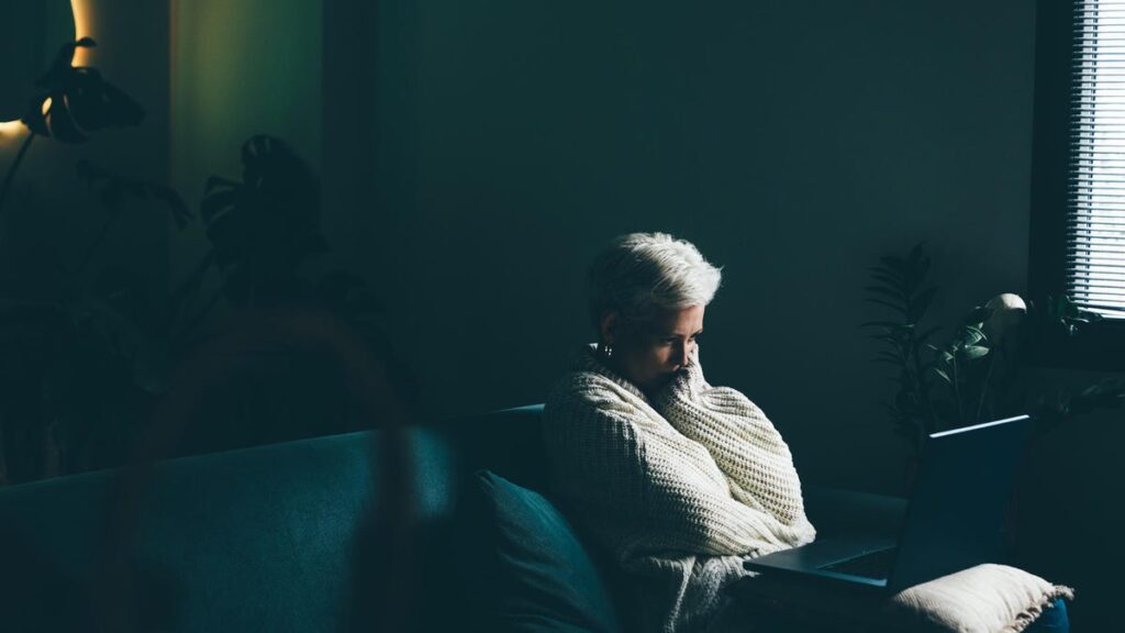 AI Chatbots Are Inconsistent in Answering Questions About Suicide, New Study Finds Sad woman using laptop at home