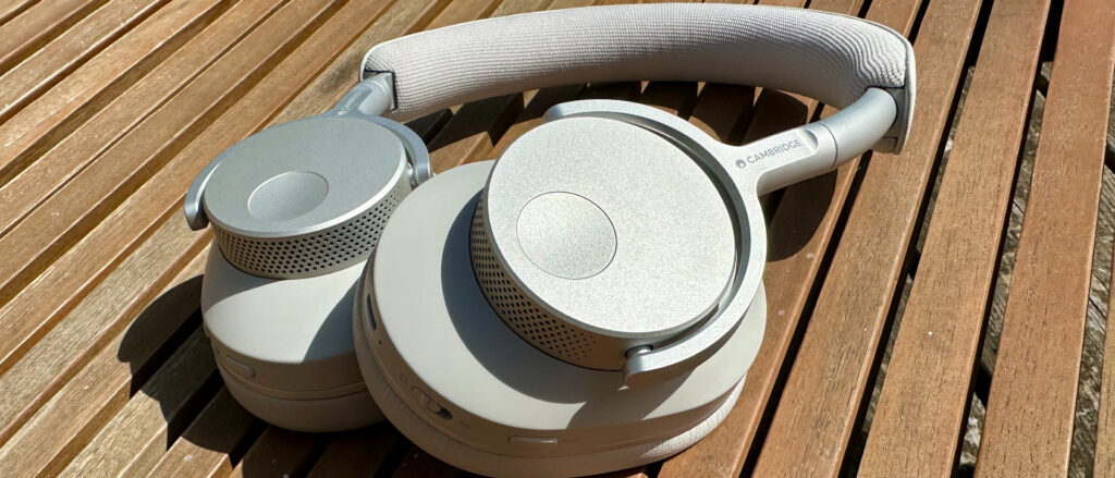 Cambridge Audio Melomania P100 review: incredible value wireless over-ear headphones that last and last (and last) Cambridge Audio P100 on a wooden table in the sun