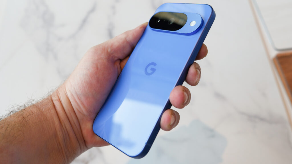 Google Pixel 10 in hand from 3/4 angle