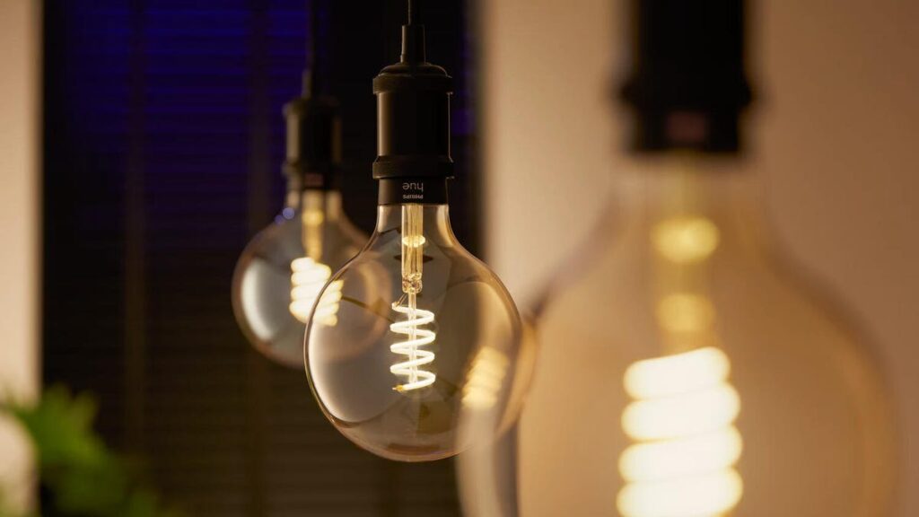 Philips Hue LED globe lights closeup with warm lighting.