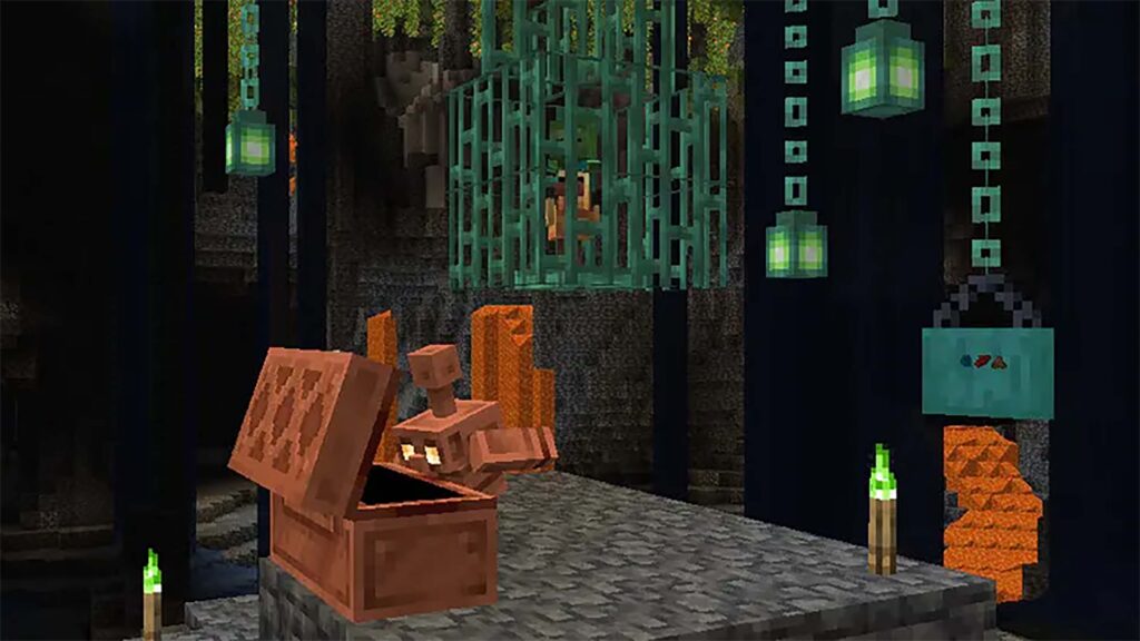 Copper chains handing indoors in Minecraft.