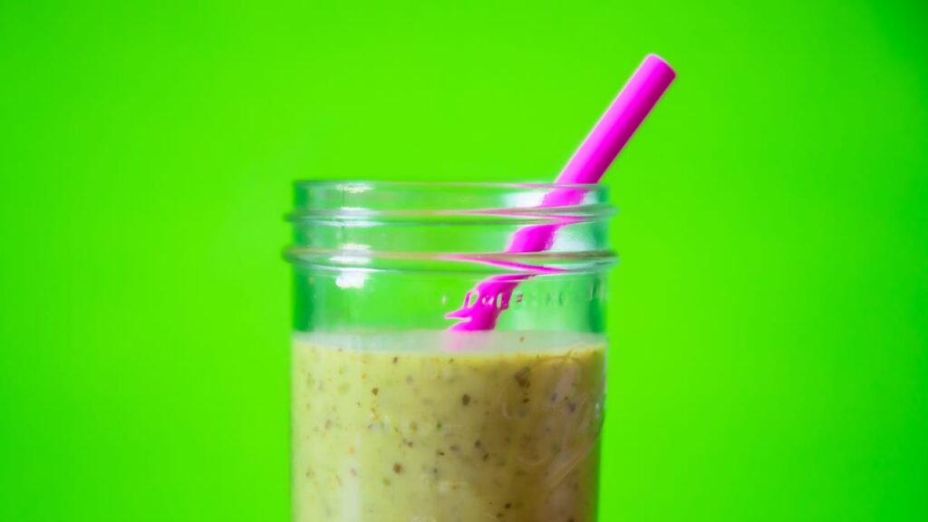 Smoothie in a Mason jar with a straw