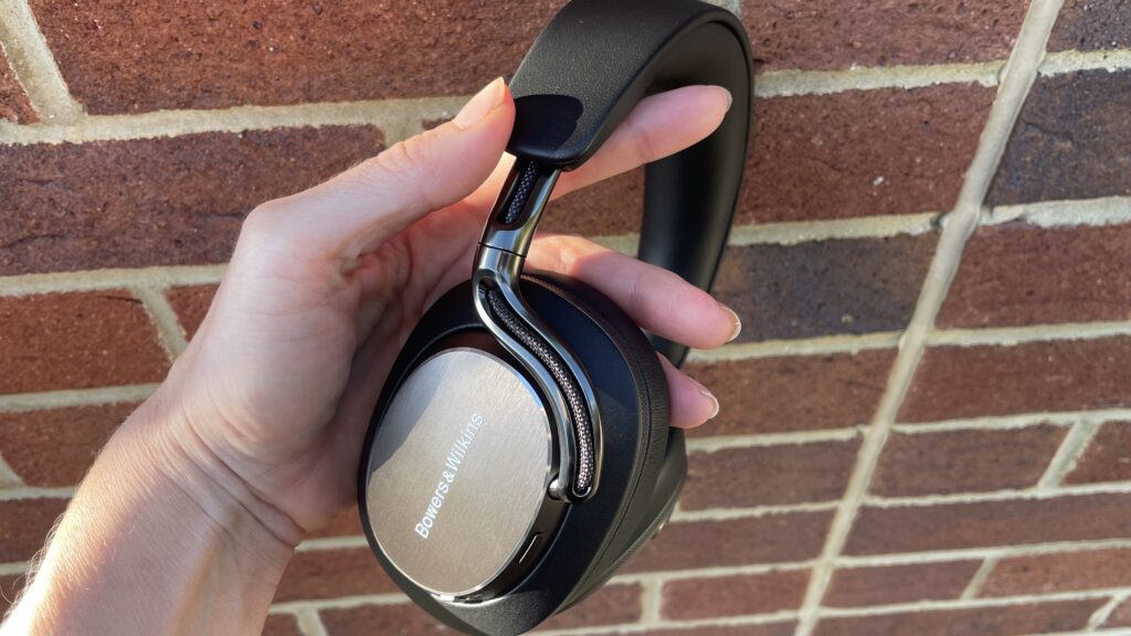 Bowers &amp; Wilkins Px8 S2 in front of a red brick wall