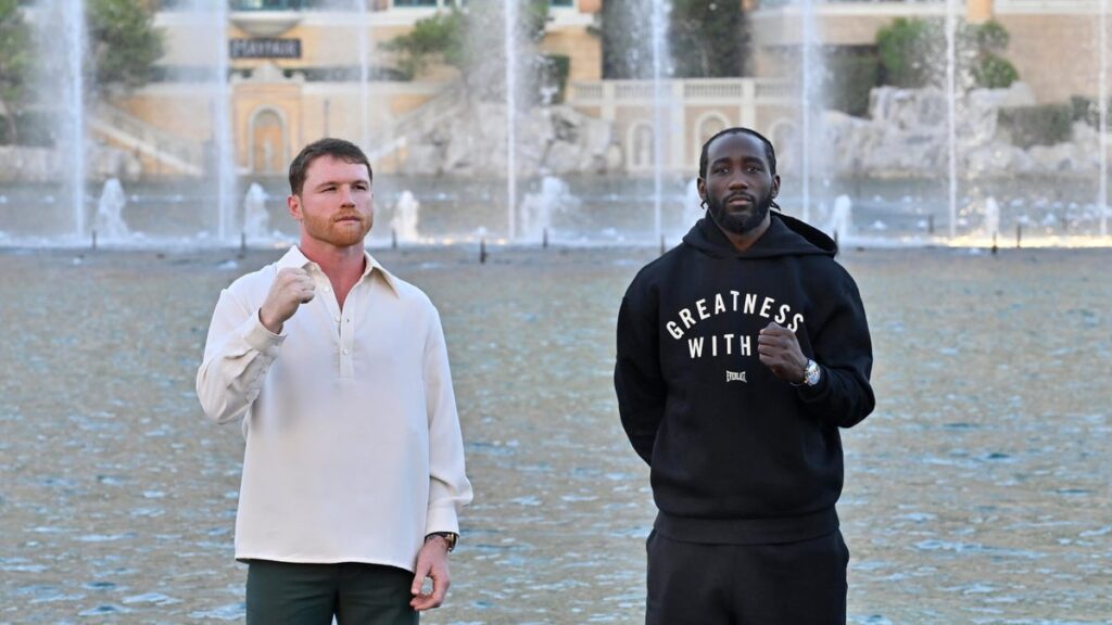 Canelo vs. Crawford: When to Watch the Fight Live on Netflix canelo alvarez and terence crawford pose with raised fists