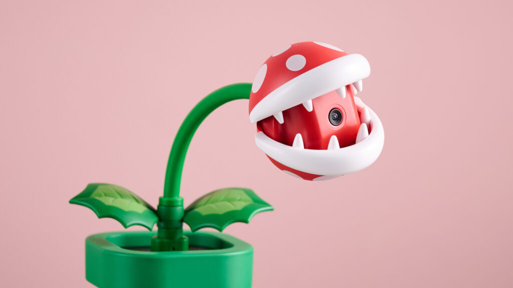 Hori Piranha Plant Camera for Nintendo Switch 2 with mouth open on pink background