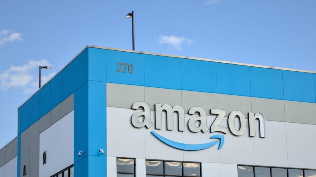 Amazon company logo with damaged letter 'n' on warehouse office building in Red Hook, Brooklyn, New York City