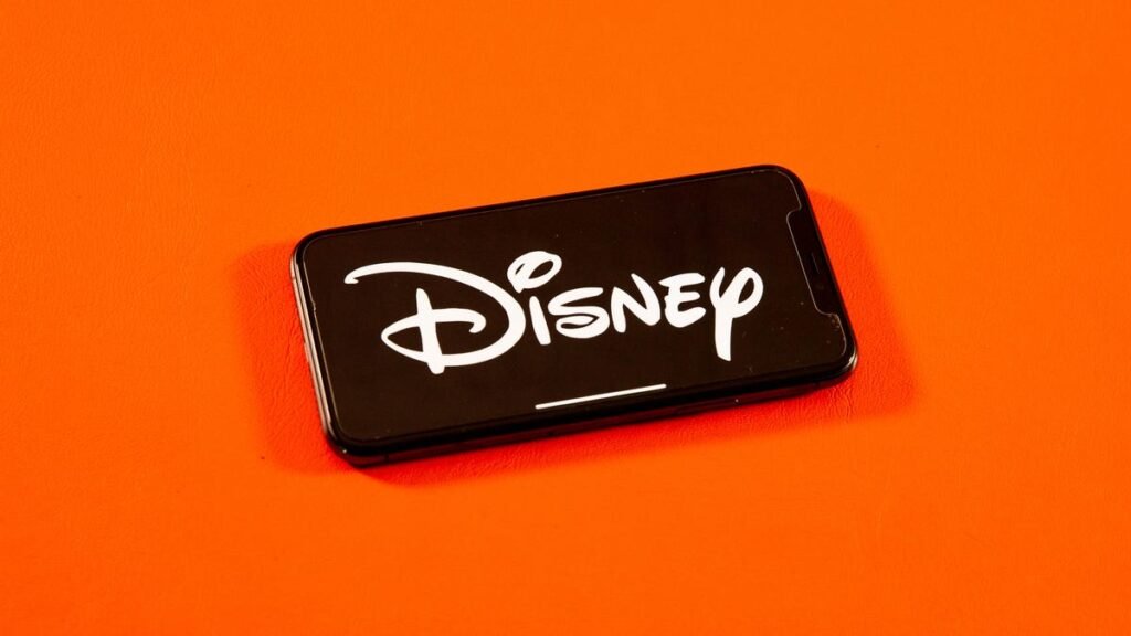 Disney Settles FTC Complaint With YouTube Over Children’s Data Collection Disney corporate logo on a phone screen