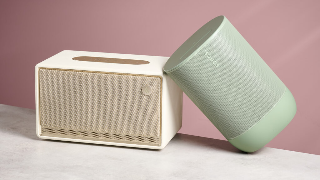 The Sonos Move 2 leaning at a 45-degree angle against the Edifier ES300 in front of a pink background.