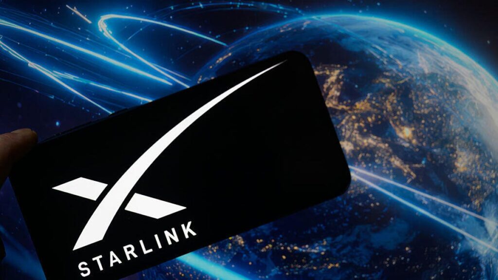 Elon Musk Says Starlink Could Replace Your Cellphone Carrier An image of the Starlink logo on a phone, with Earth and satellites in the background (gettyimages-2224910960)