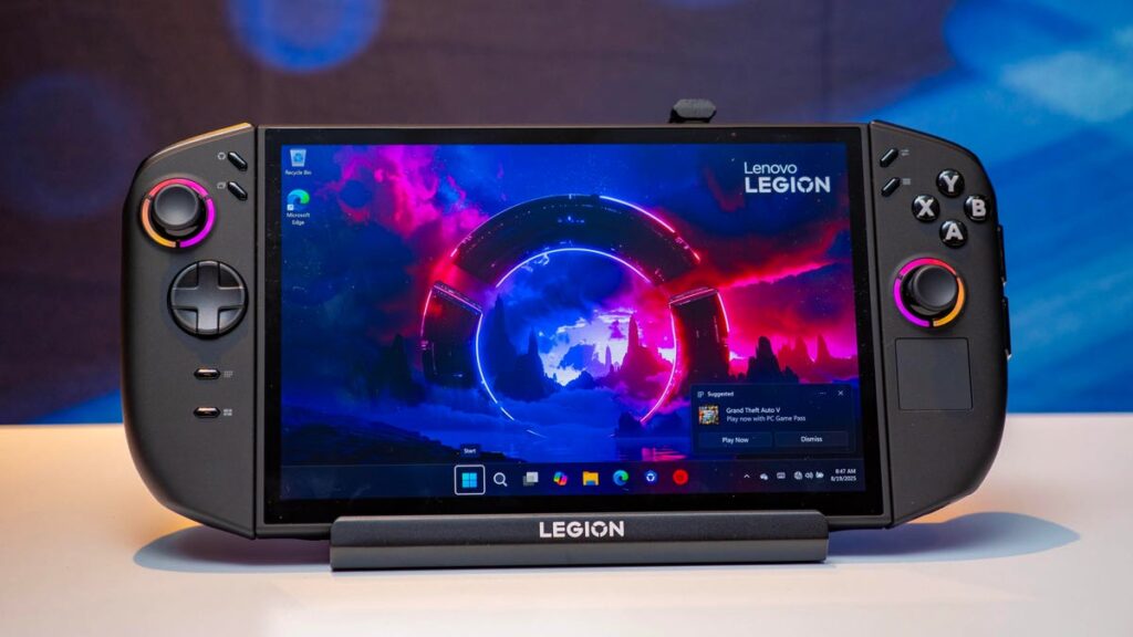 Lenovo Legion Go 2 Windows gaming handheld sitting in a docking cradle on a white table.