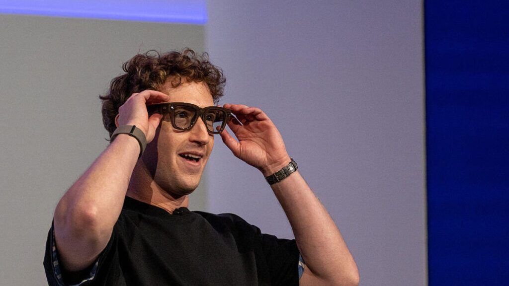 Mark Zuckerberg, chief executive officer of Meta Platforms Inc., wears a pair of Meta Ray-Ban Display AI glasses during the Meta Connect event
