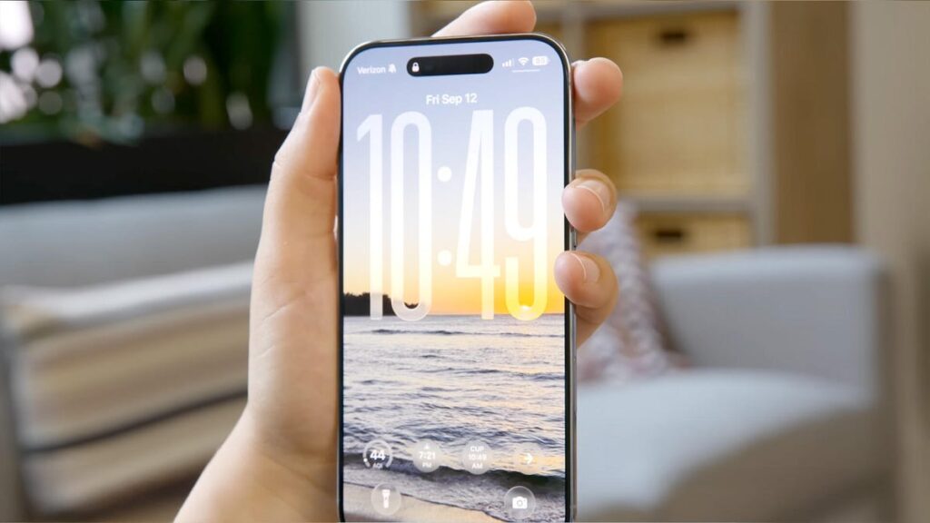 The iPhone Air in hand, with a wallpaper of the beach