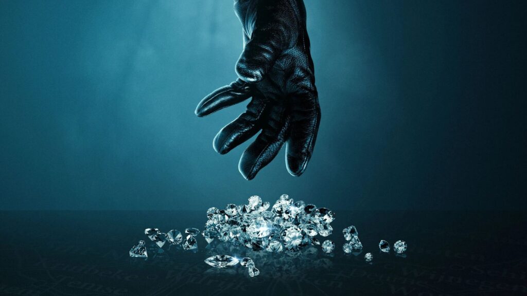 A gloved hand reaches towards a pile of diamonds