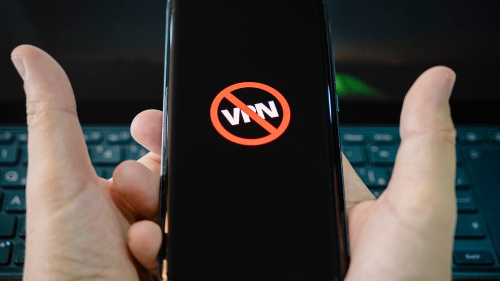 A black phone screen showed a VPN logo blocked.