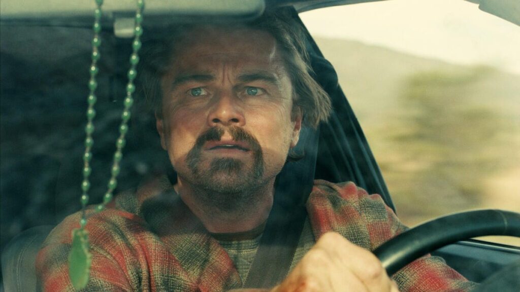 leonardo dicaprio as bob driving a car in one battle after another