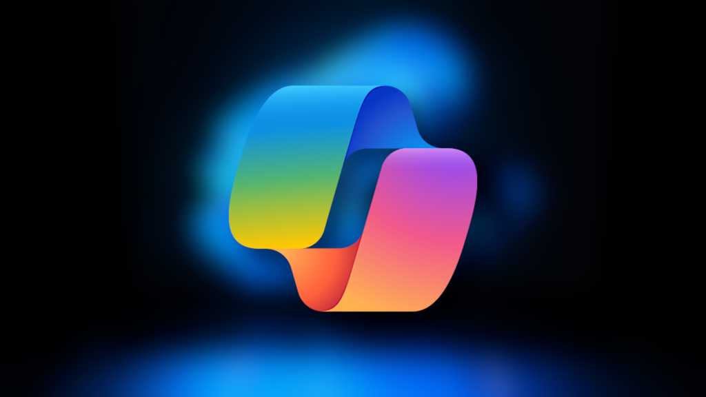 OneDrive gets Copilot AI features like file comparisons and summaries Microsoft Copilot logo on blurred Windows 11 laptop background