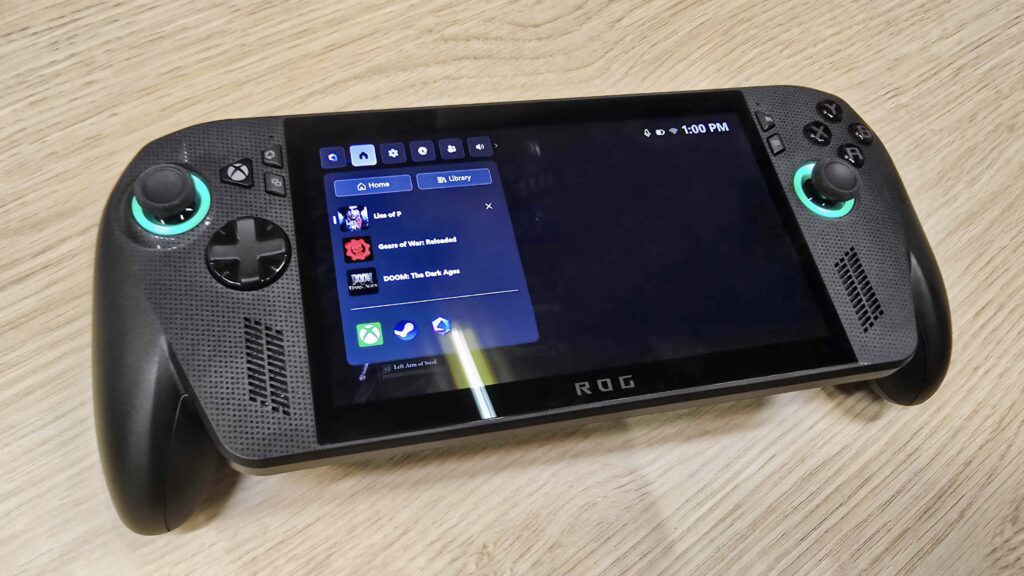 ROG Xbox Ally X on a wooden table with the side menu open.