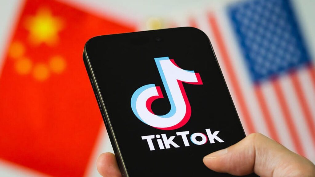 TikTok Deal Has Unanswered Questions — What That Means for You The TikTok logo is shown in front of American and Chinese flags