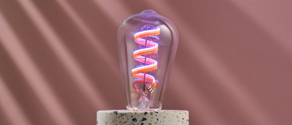 The LEDs in the WiZ filament bulb are lit up in various colors.