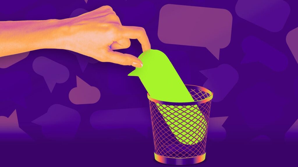 Hand taking out a green text bubble from a trashcan.