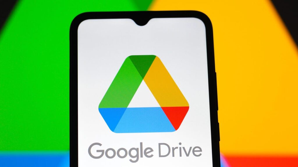 Free Up More Google Drive Space at No Cost With These Hacks Google Drive logo on a smartphone.