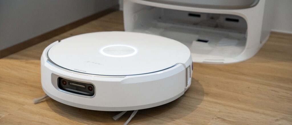 Narwal Flow robot vacuum next to its base