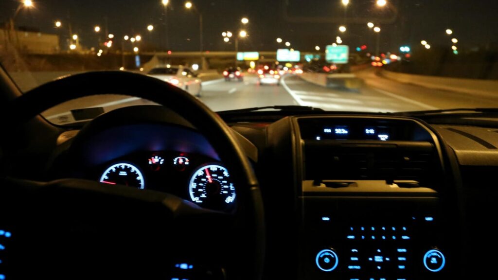 Car dash on highway at night